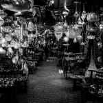 Mesmerizing black and white scene of traditional lanterns in a Marrakesh souk.