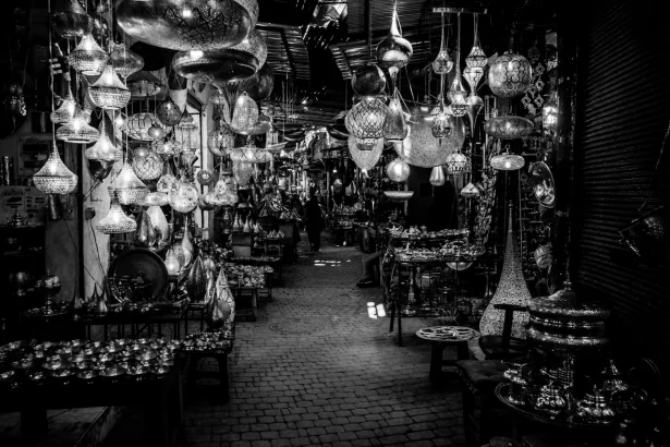 Mesmerizing black and white scene of traditional lanterns in a Marrakesh souk.