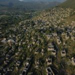 Explore the abandoned stone houses of Kayaköy Ghost Town in Fethiye, Turkey from above.