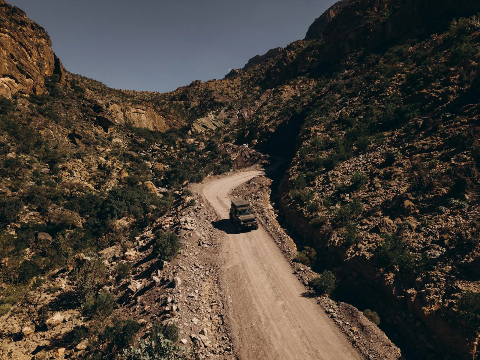 Explore a rugged off-road journey through stunning desert mountain landscapes in Oman.