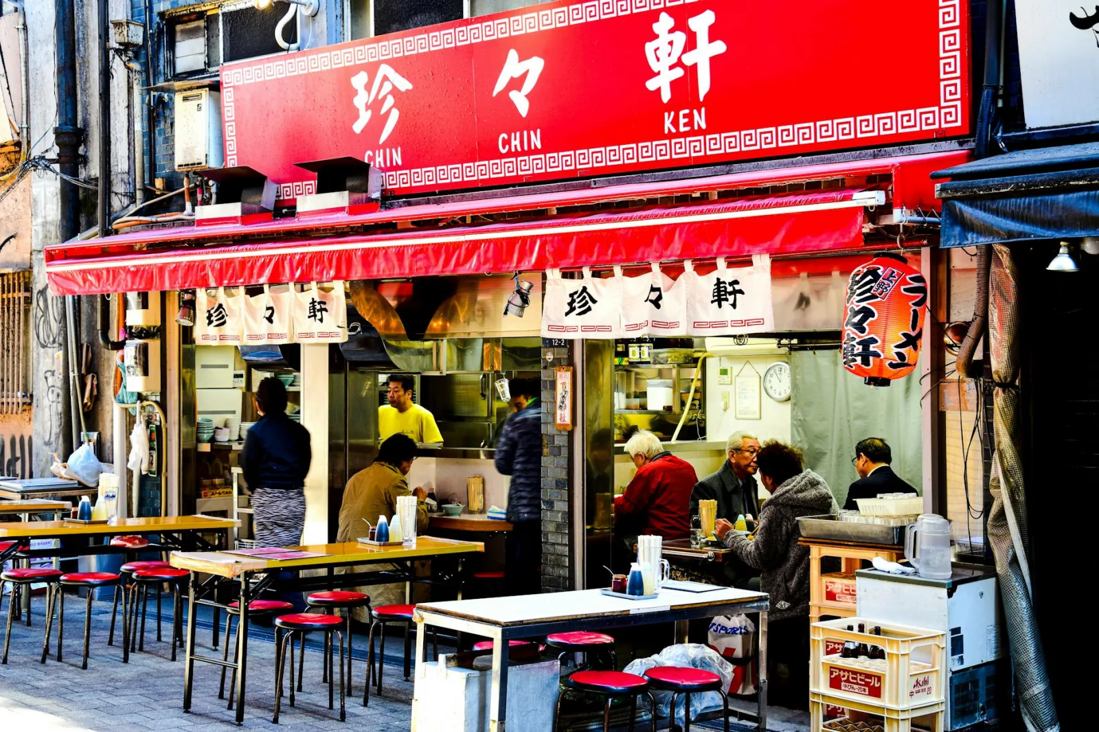 A bustling street food bar scene in Japan capturing the lively urban atmosphere.