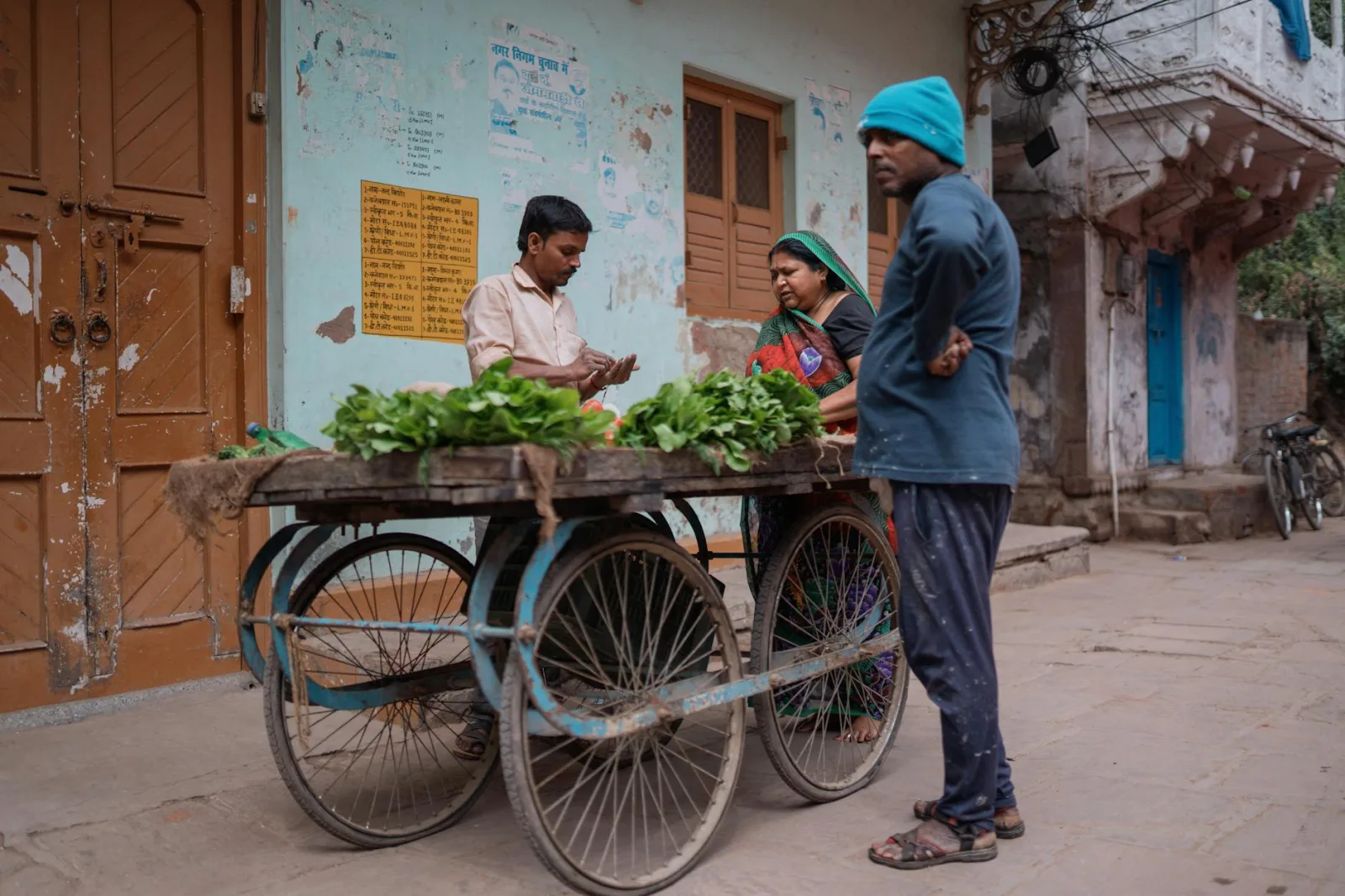 Street vendor selling fresh greens in Varanasi, capturing daily life in India.