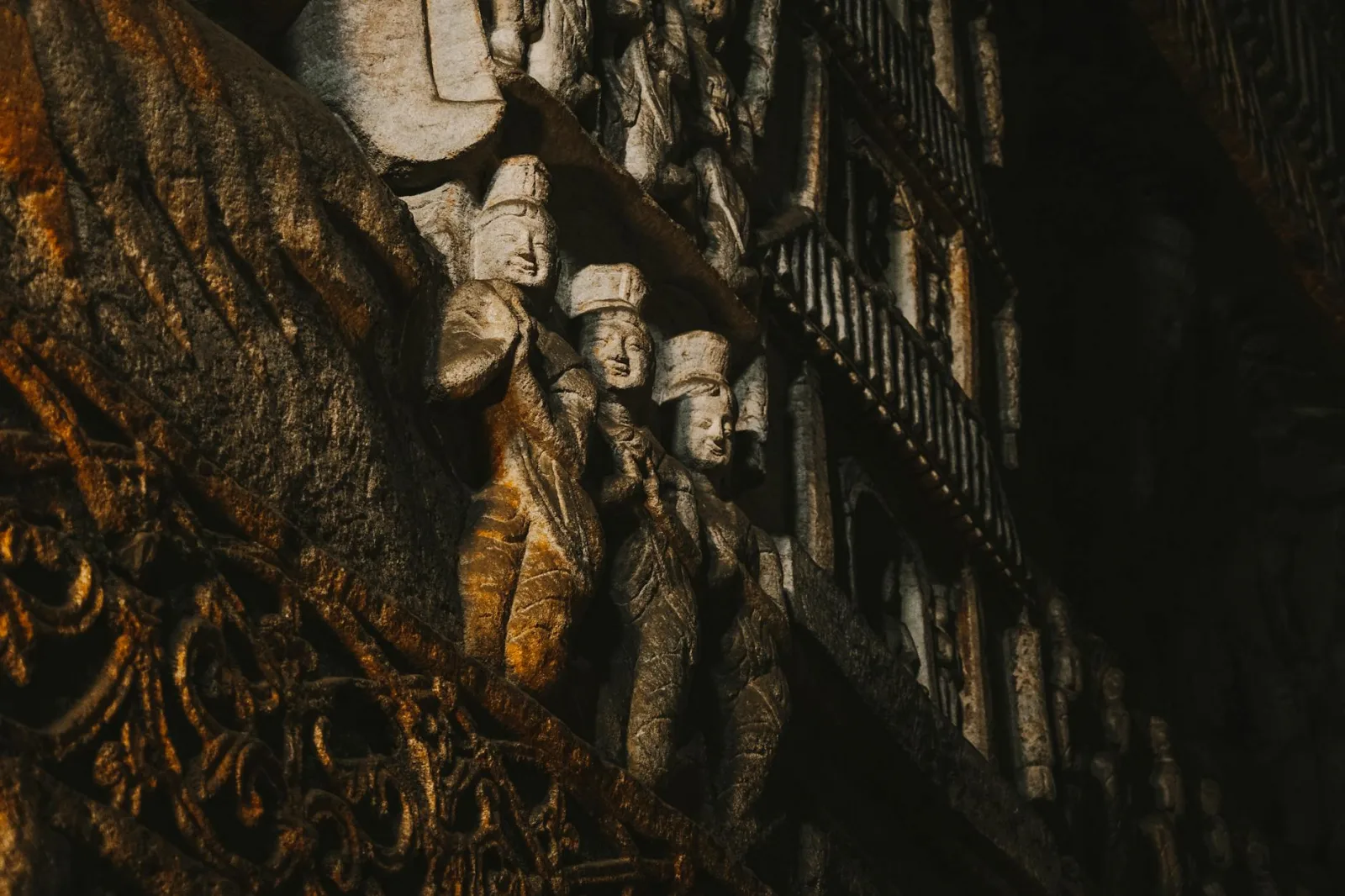 Explore the intricate stone carvings of Yungang Grottoes, capturing ancient Chinese artistry.