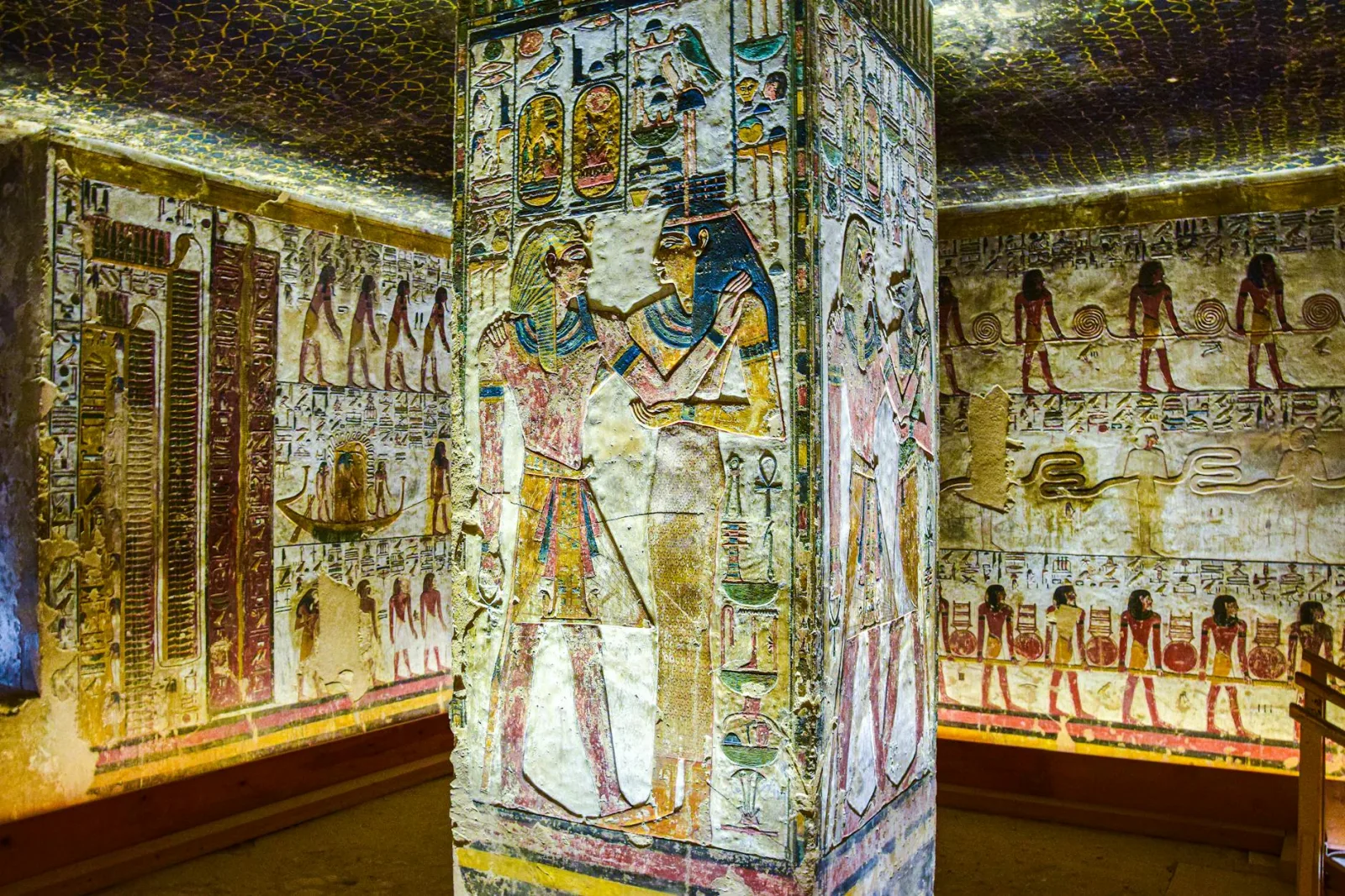 Detailed wall paintings in the Tomb of Seti I showcasing ancient Egyptian art.