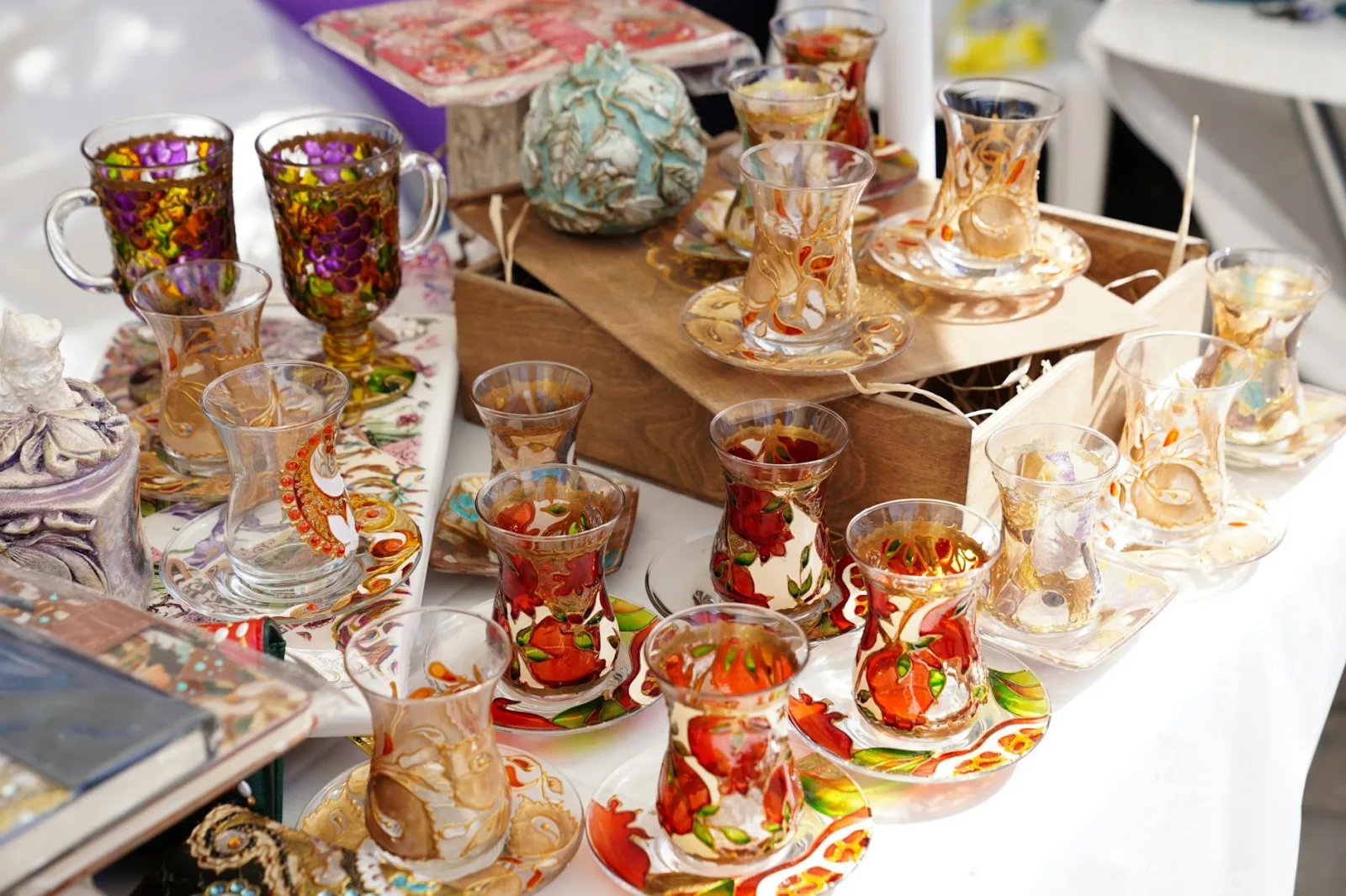 A collection of vibrant Azerbaijani hand-painted tea cups and saucers. Perfect depiction of cultural craftsmanship.