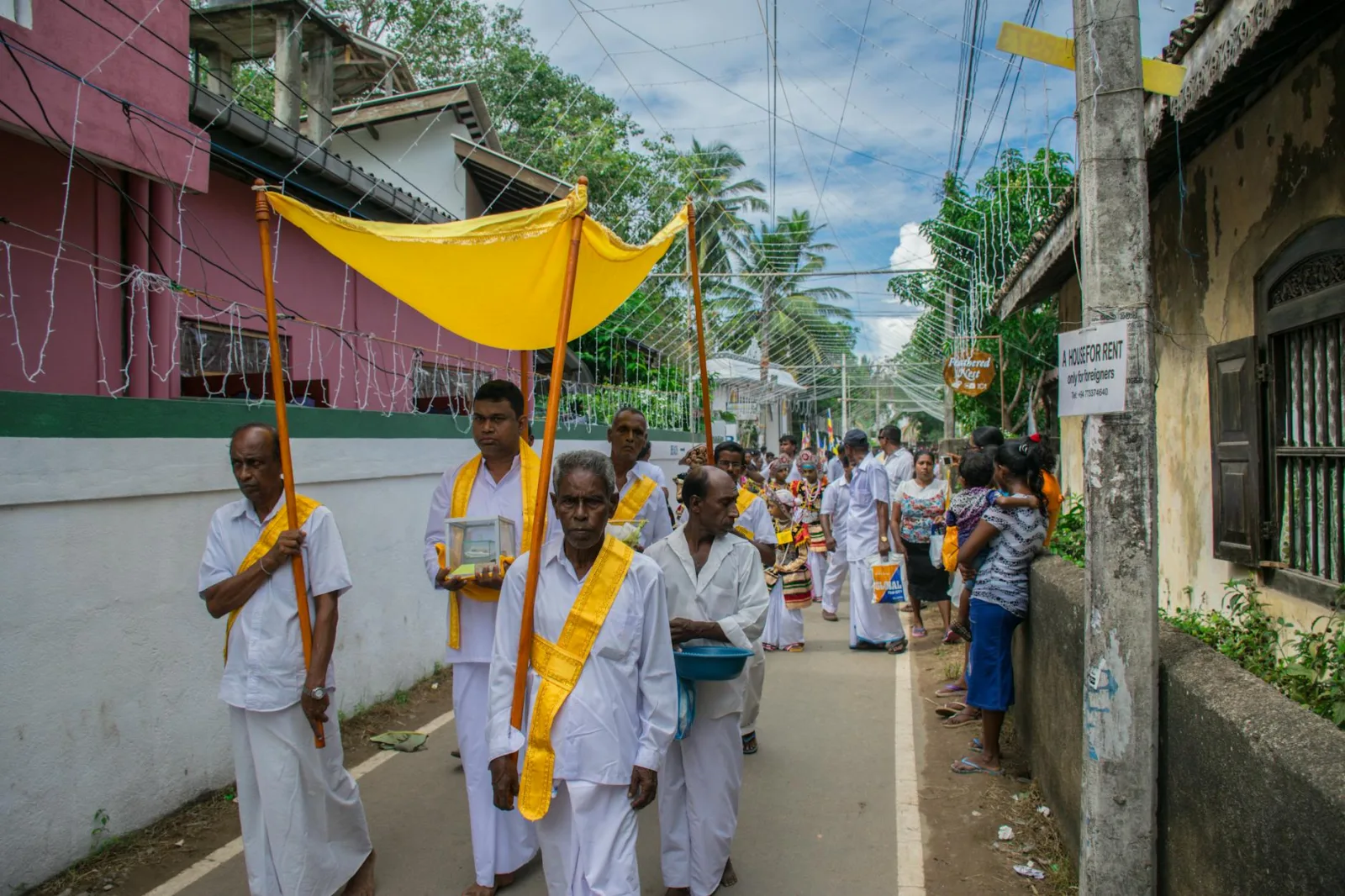 Cultural Buddhist procession on Mirissa street showcasing vibrant traditions and community spirit.