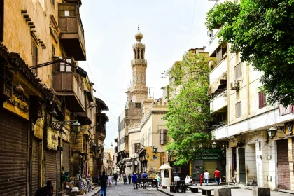 Explore the charm of a bustling historic street in Cairo with stunning architecture and cultural vibrancy.