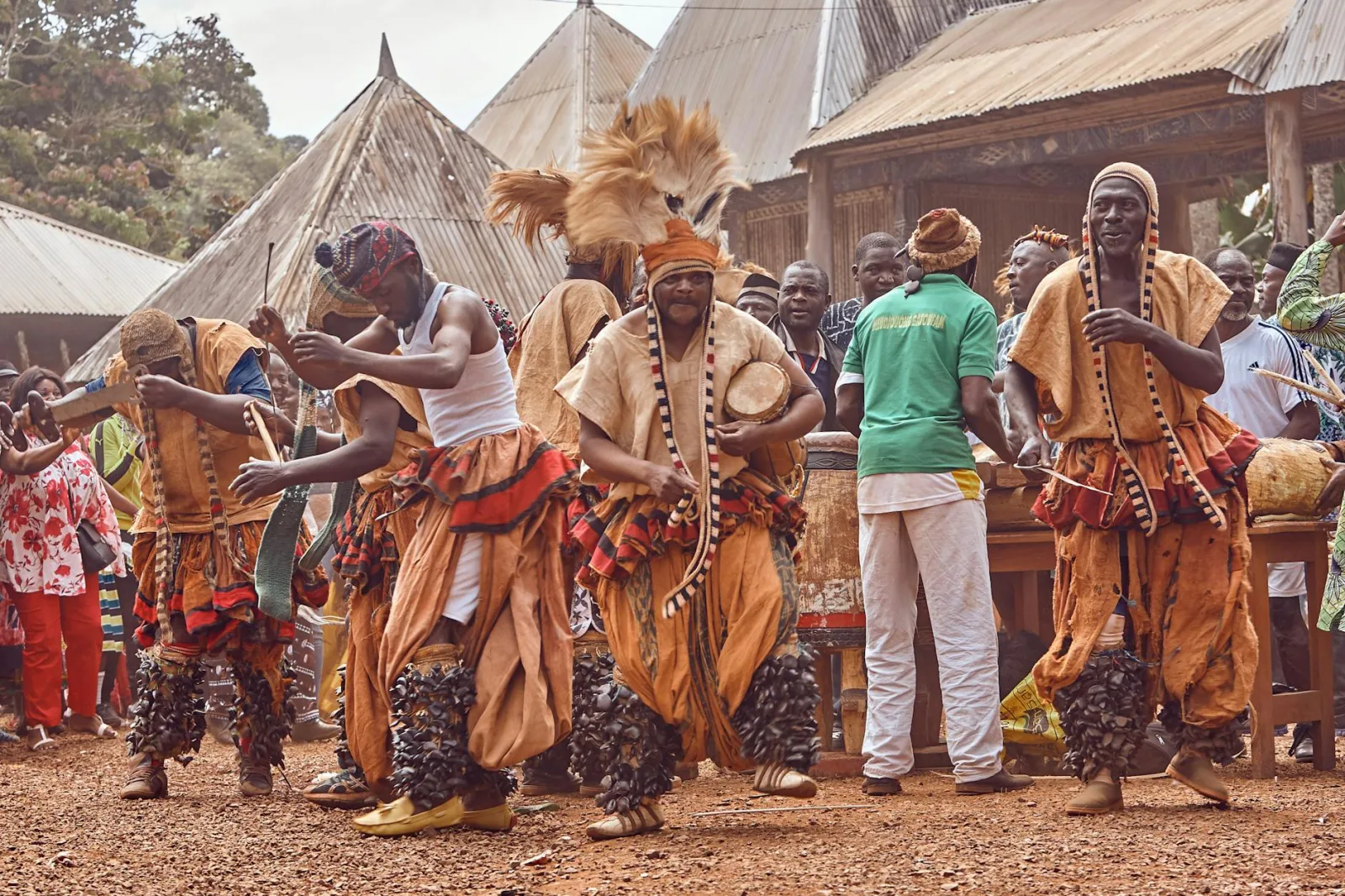 Captivating scene of a traditional African dance with colorful costumes and joyful expressions.