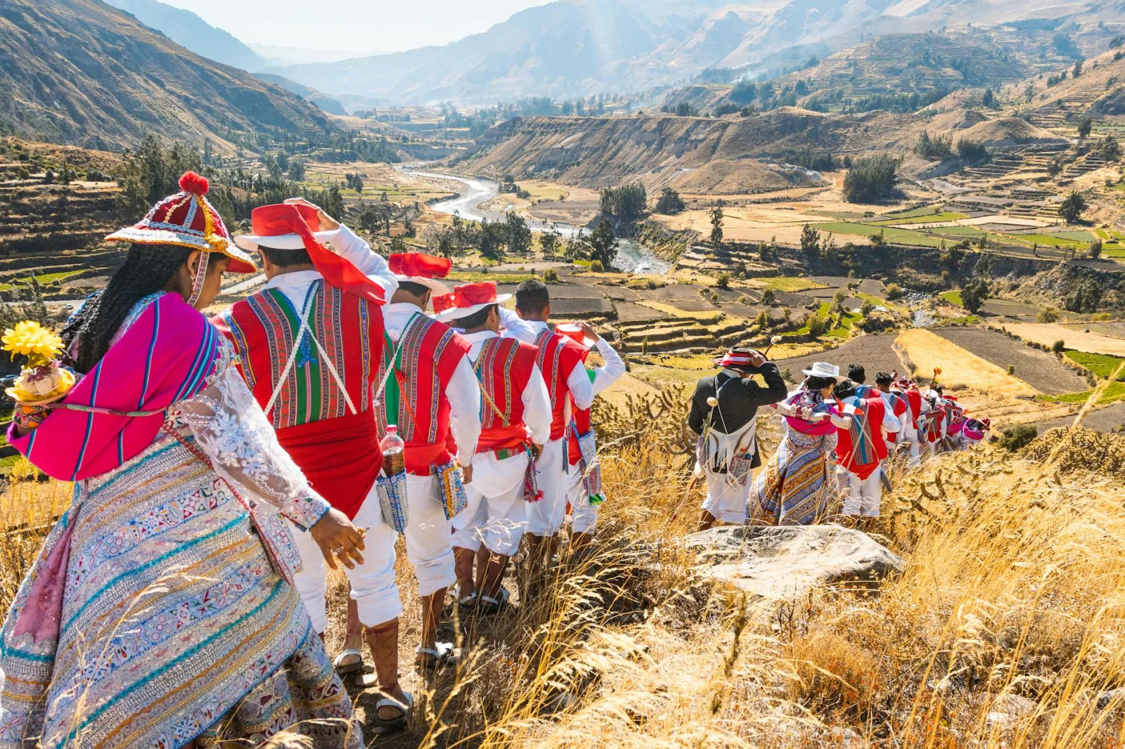 Vibrant Andean festival in Cayma, Peru with locals in traditional costumes celebrating cultural heritage.