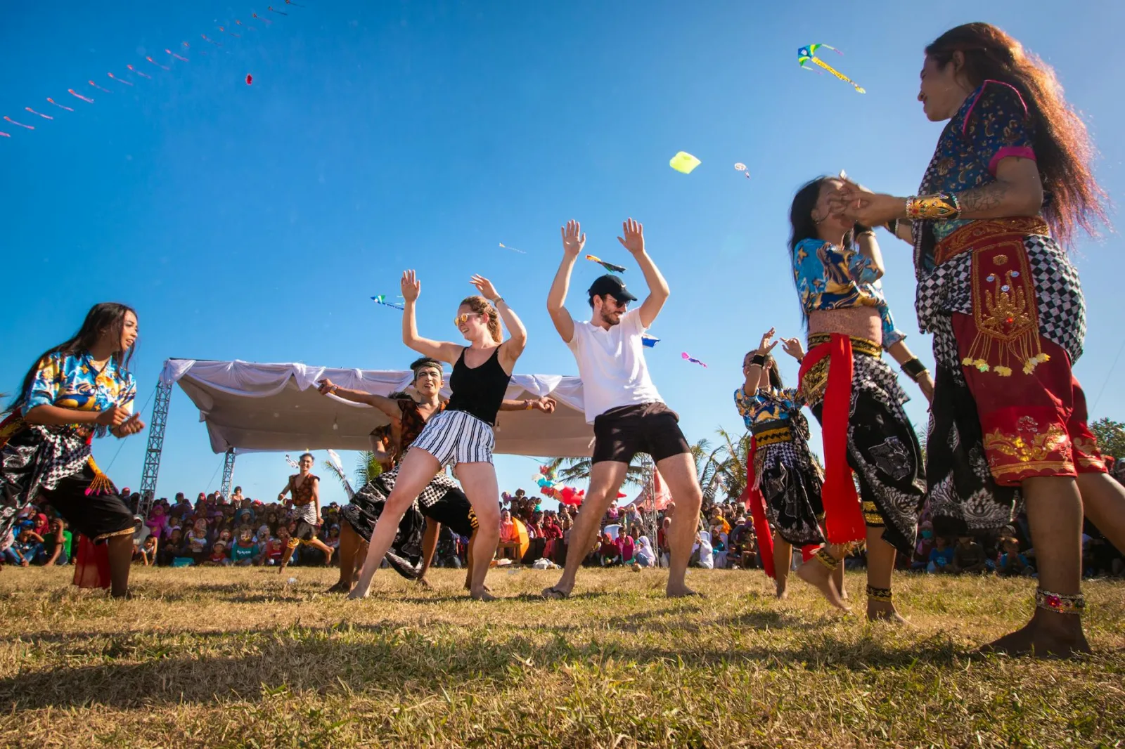 Vibrant cultural dance festival in West Java, highlighting diverse traditions and joyful community interaction.