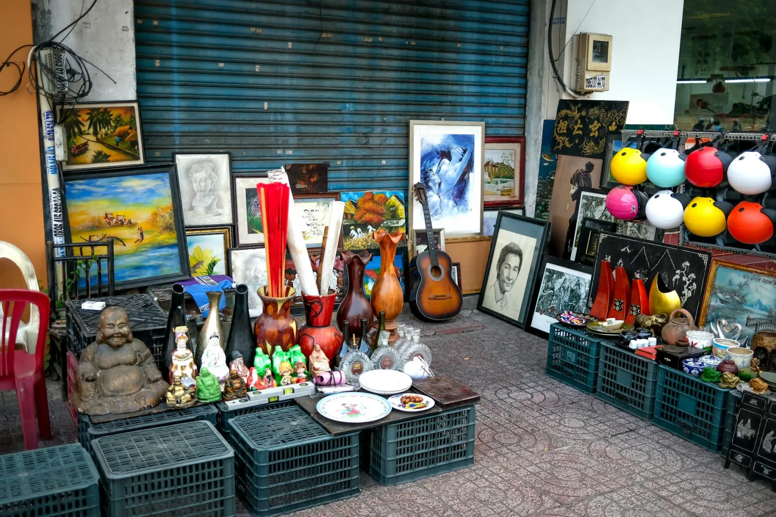 A vibrant mix of antiques, art, and decorations outside a thrift shop.