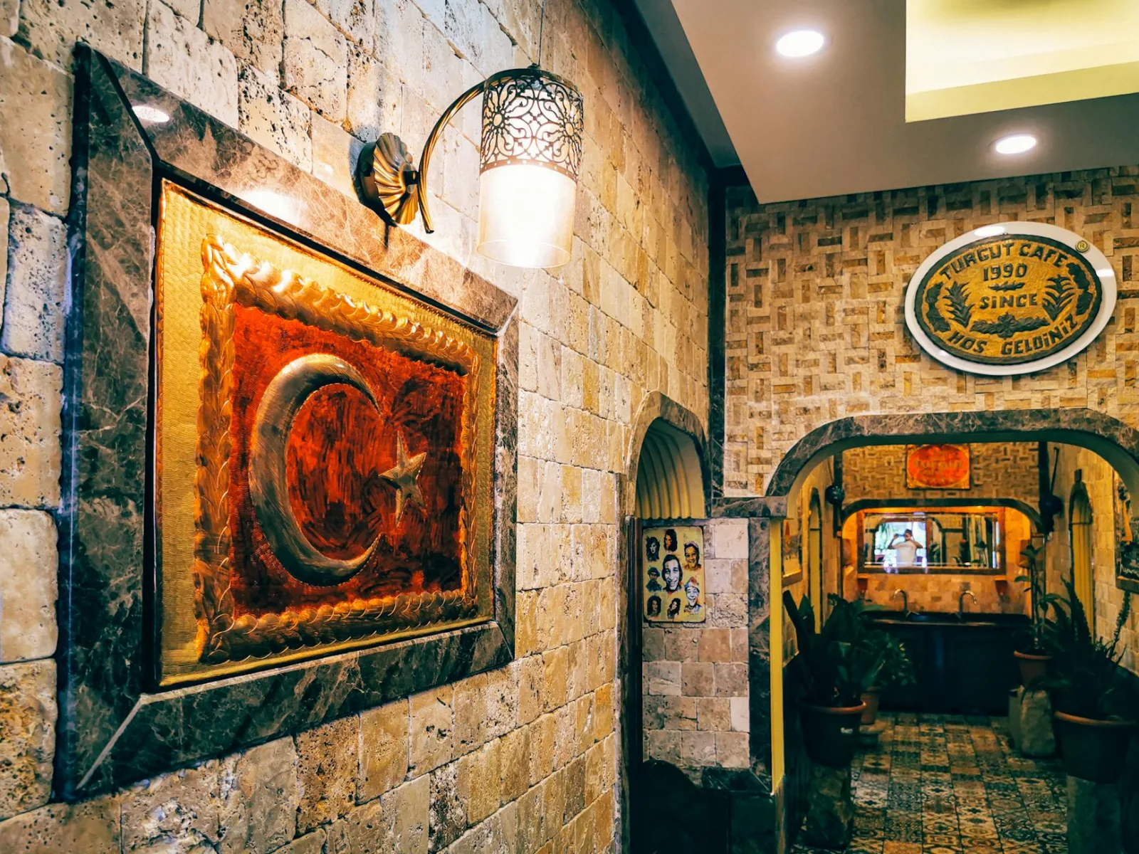 Explore the charming interior of a Turkish cafe in Arsuz, featuring unique wall decor and traditional elements.