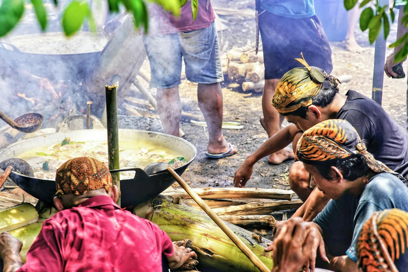 Men preparing traditional Indonesian dish outdoors in Central Java.