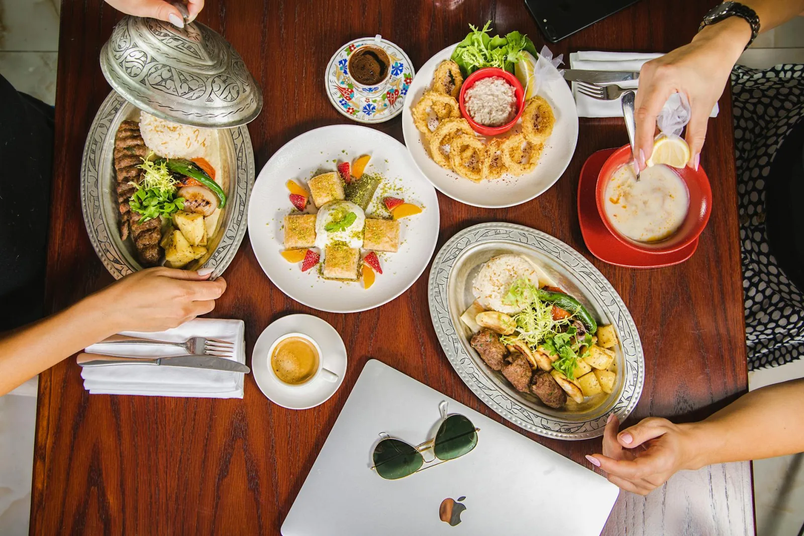 Colorful and delicious spread of Middle Eastern dishes at a Dubai cafe, showcasing vibrant flavors.