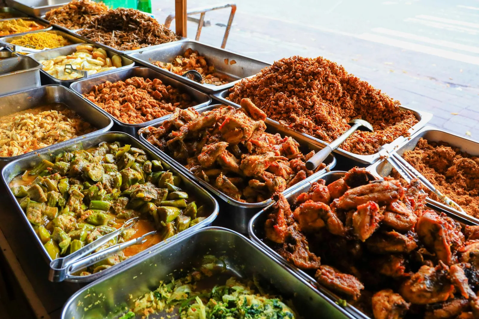 A vibrant display of traditional Balinese street food showcasing a variety of colorful dishes.