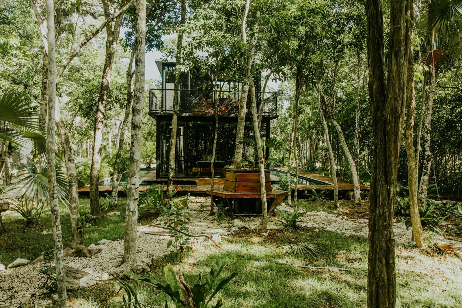 Explore a serene treehouse retreat nestled in lush forest greenery, perfect for nature lovers.