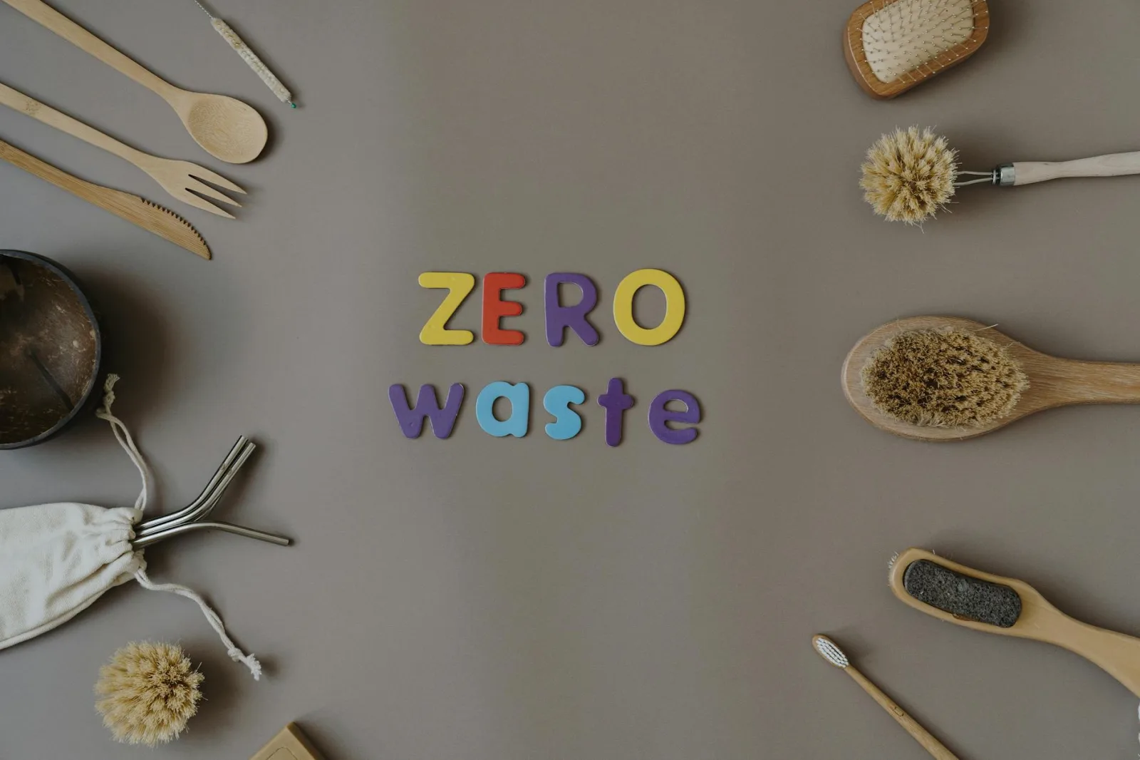 A stylish flat lay of zero waste kitchen and personal care items emphasizing sustainability.