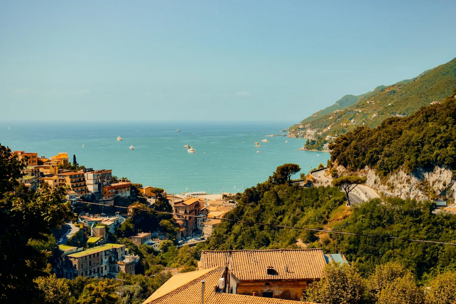 Breathtaking view of Salerno's coastline in Campania, Italy with vibrant sea and lush hills.