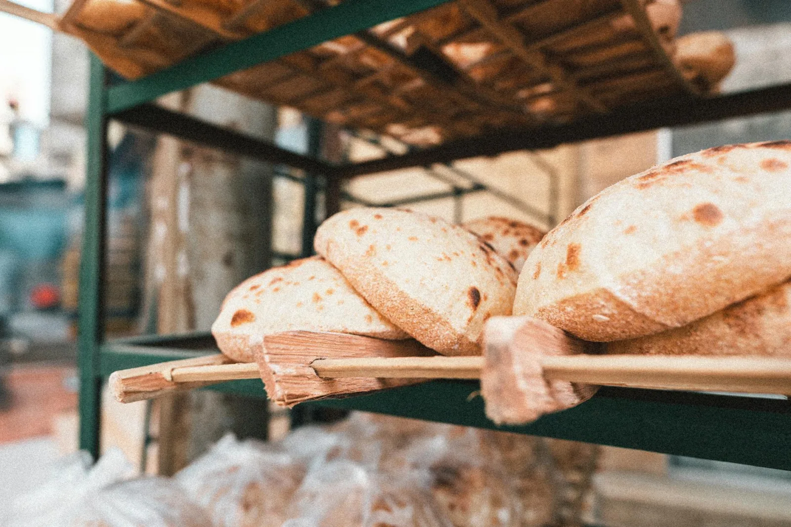 Delicious freshly baked bread on display in a traditional Cairo bakery.