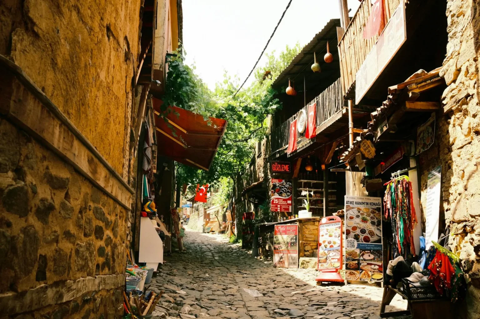Explore the quaint cobblestone streets lined with shops in historic Bursa, Turkey.
