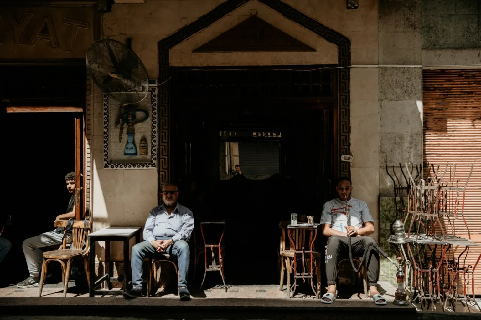 People enjoying a coffee break outside a cafe in Cairo, Egypt.