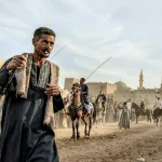 Men and horses at a traditional festival parade in Egypt, showcasing cultural heritage and equestrian skills.