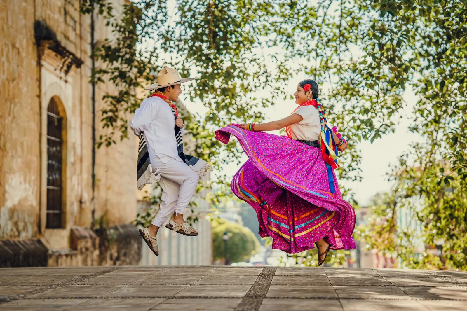 Vibrant traditional folk dance in Oaxaca, showcasing colorful costumes and cultural expression.