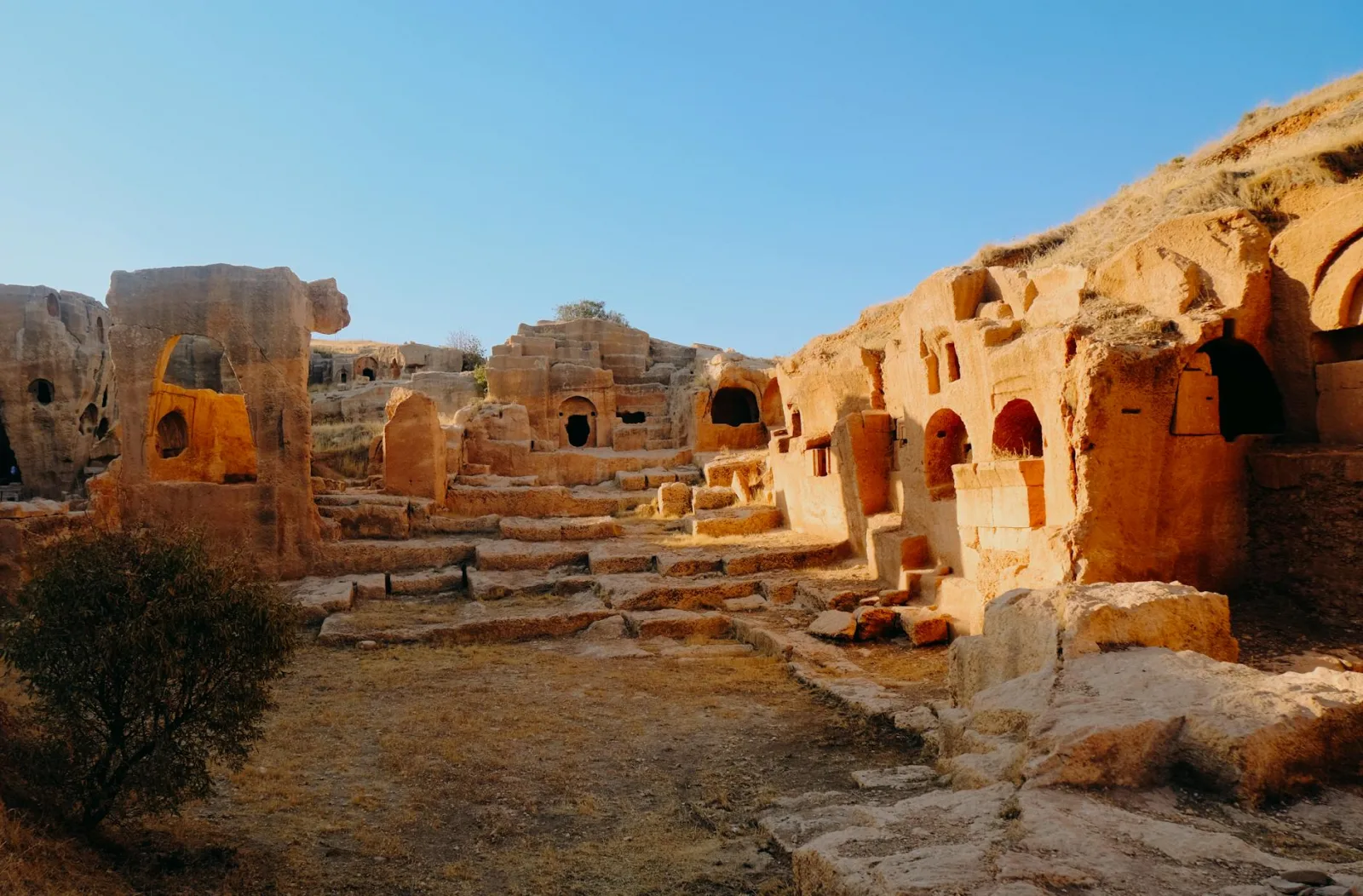 Explore historic stone ruins bathed in sunlight, revealing ancient civilization's architectural beauty.