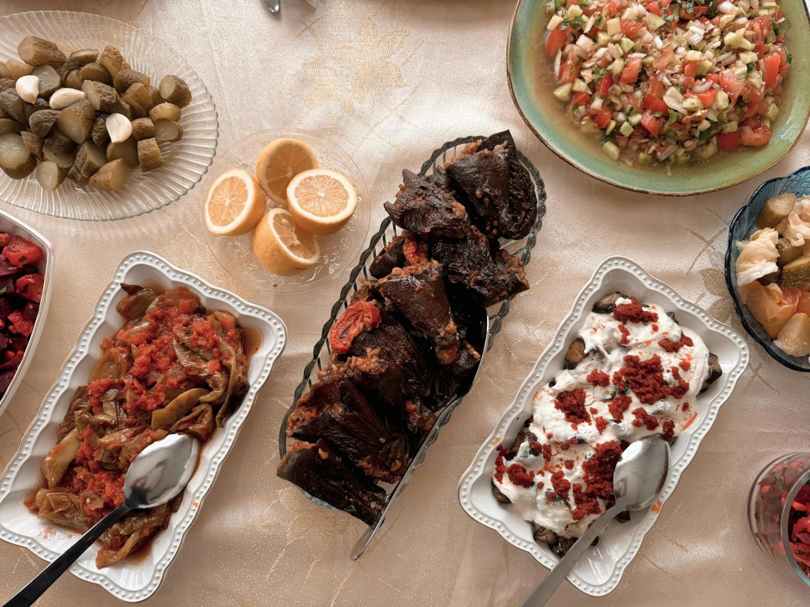 Top view of a vibrant Mediterranean spread featuring salads, pickles, and savory dishes on a table.