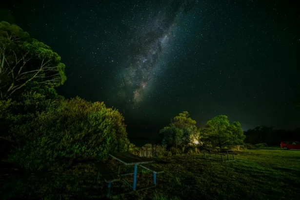 Milky Way over a picnic area in Tasmania, Australia, creates a stunning countryside night view.