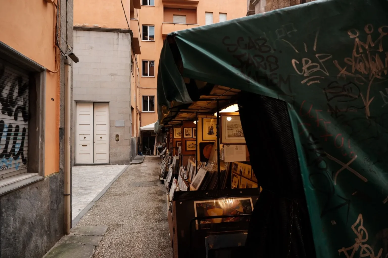 Explore the rustic charm of an antique street market stall in Lucca, Tuscany.