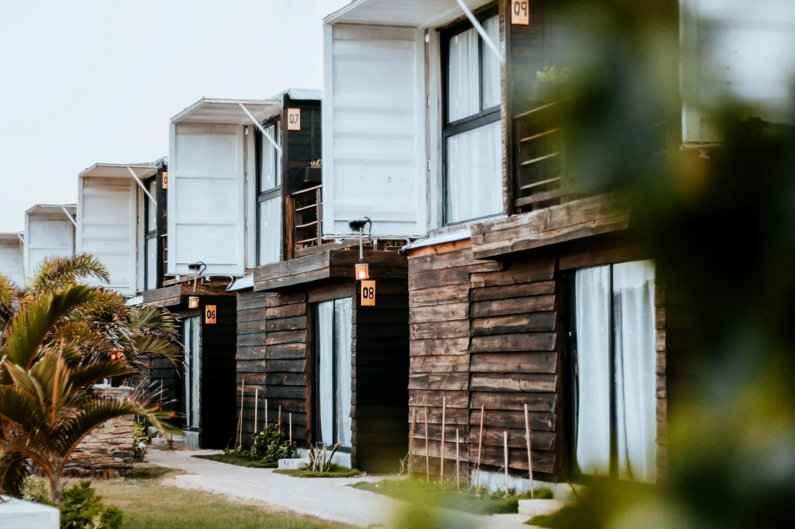 Charming wooden cottages at a resort in Adicora, Venezuela, showcasing modern architectural design.