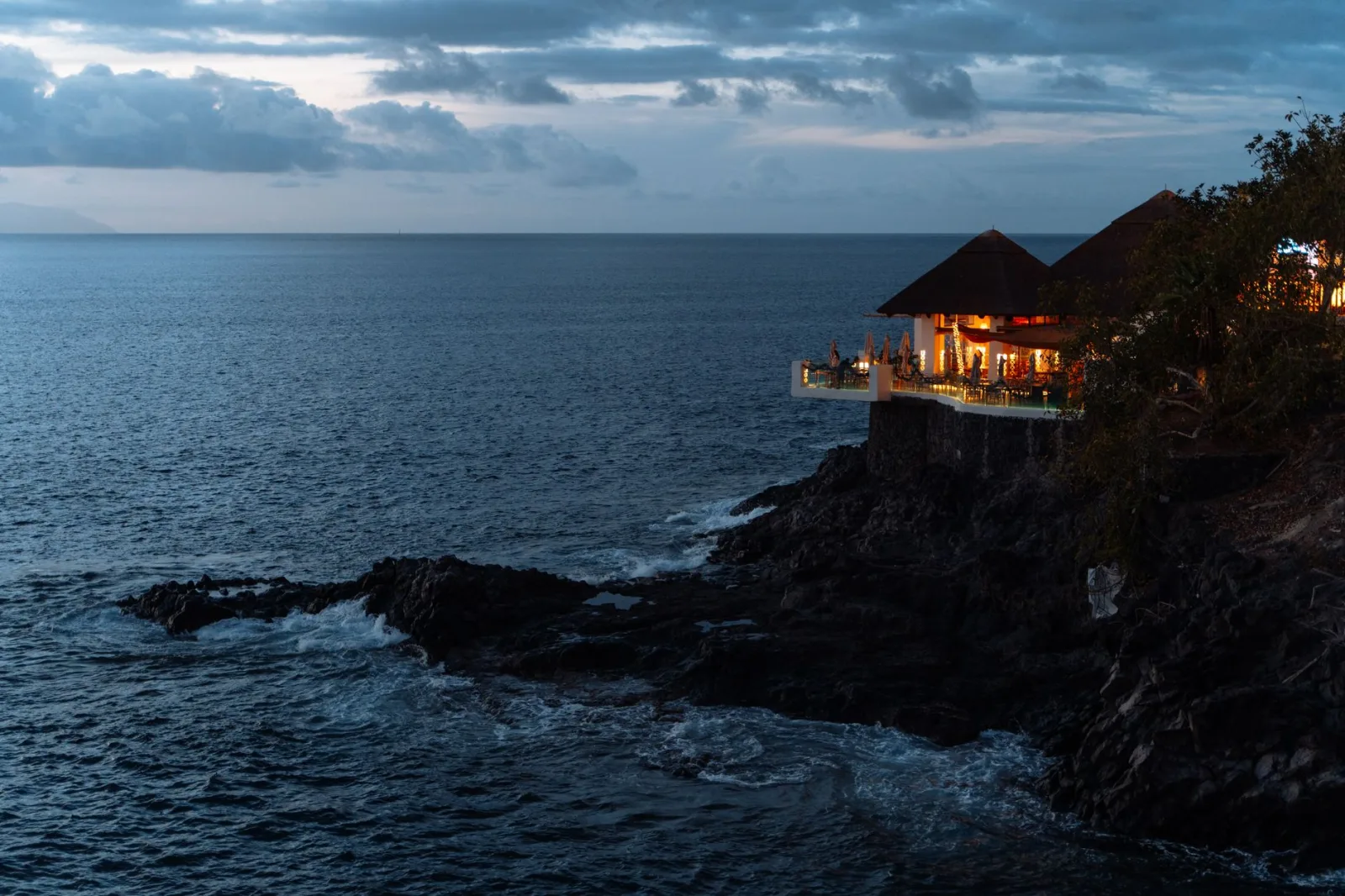 Experience tranquil clifftop dining with ocean views in the Canary Islands.