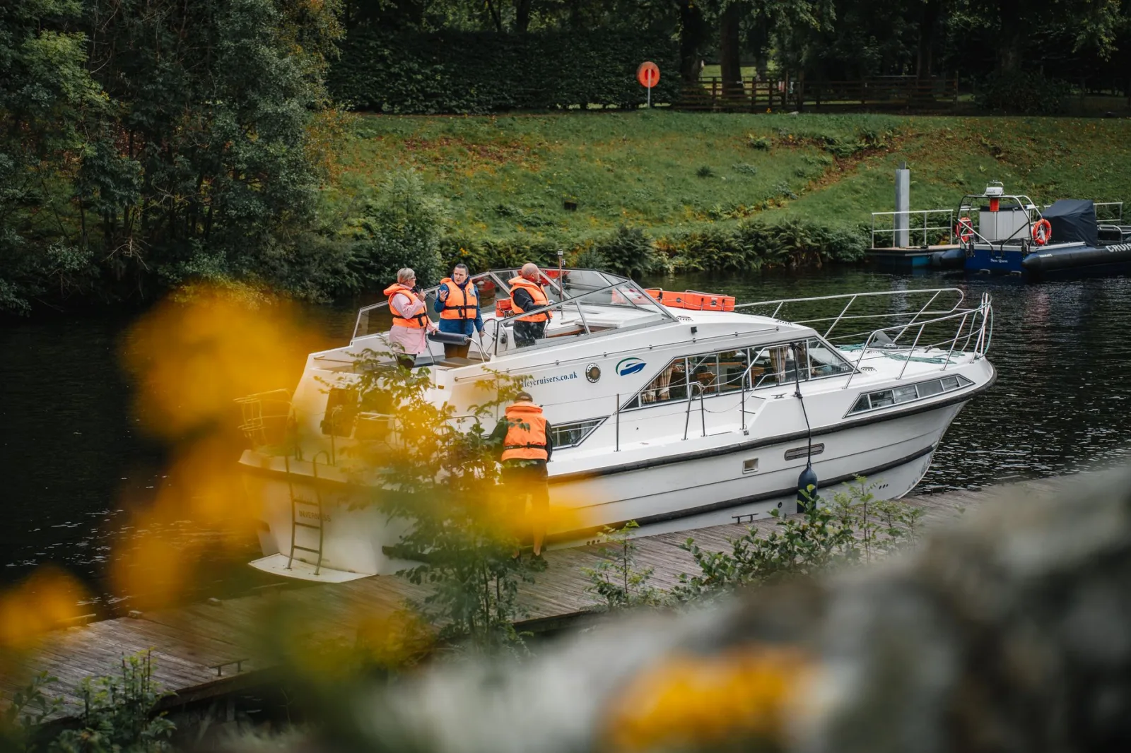 People enjoying a boat ride on Caledonian Canal, Fort Augustus.