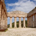Stunning view of the ancient Doric temple in Segesta, Sicily, on a sunny day.