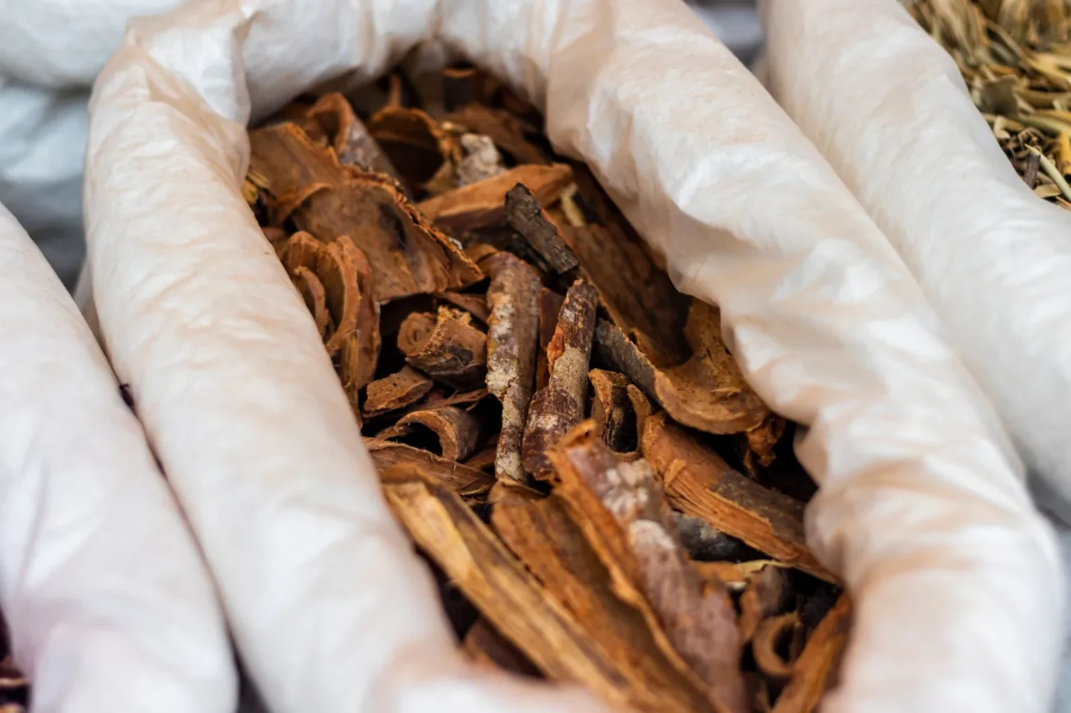 Close-up of dried bark used for herbal tea, captured in São Paulo market.