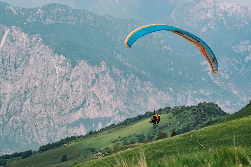 Experience the thrill of paragliding with breathtaking mountain views.