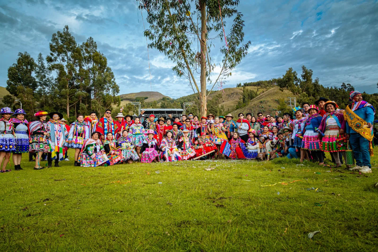 Colorful celebration with people in traditional attire in Cusco, Peru.