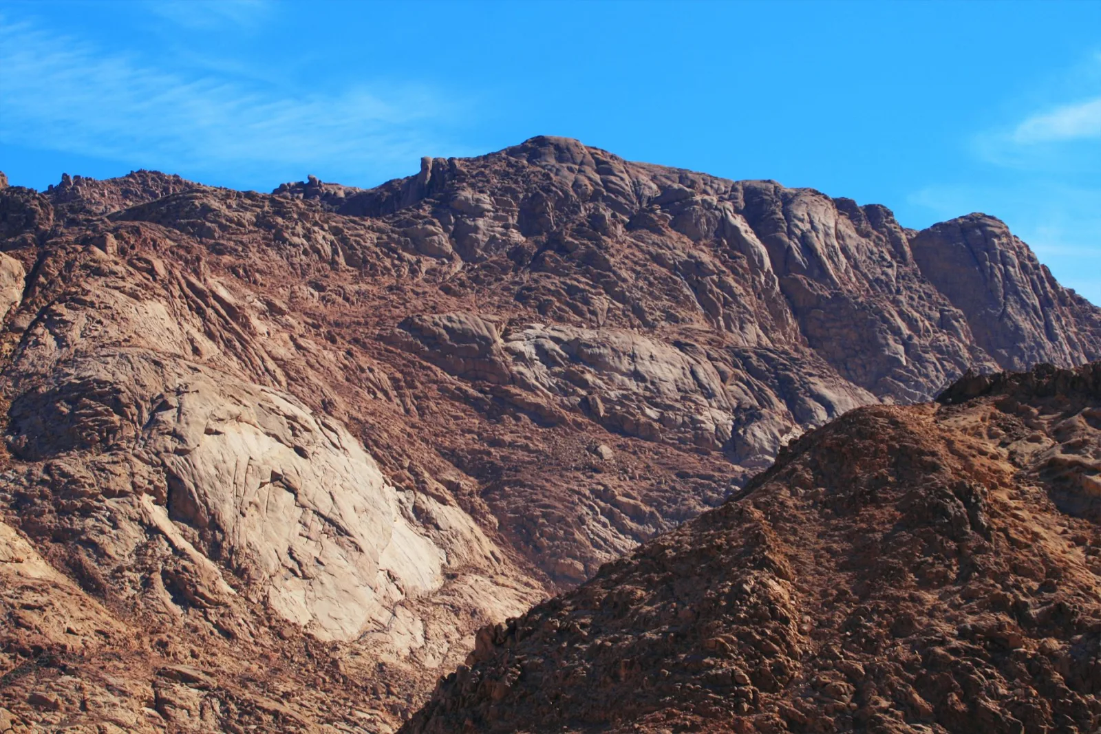 Majestic rocky mountain scene with clear blue sky, perfect for nature lovers and adventurers.