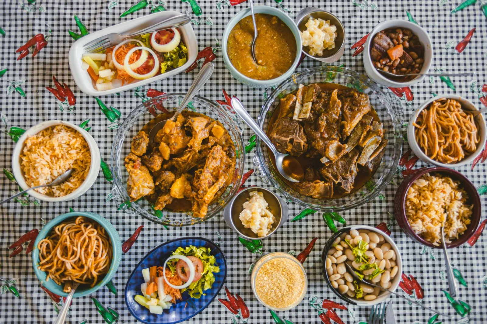 A diverse Brazilian feast displayed in a traditional setting, showcasing local cuisine varieties.