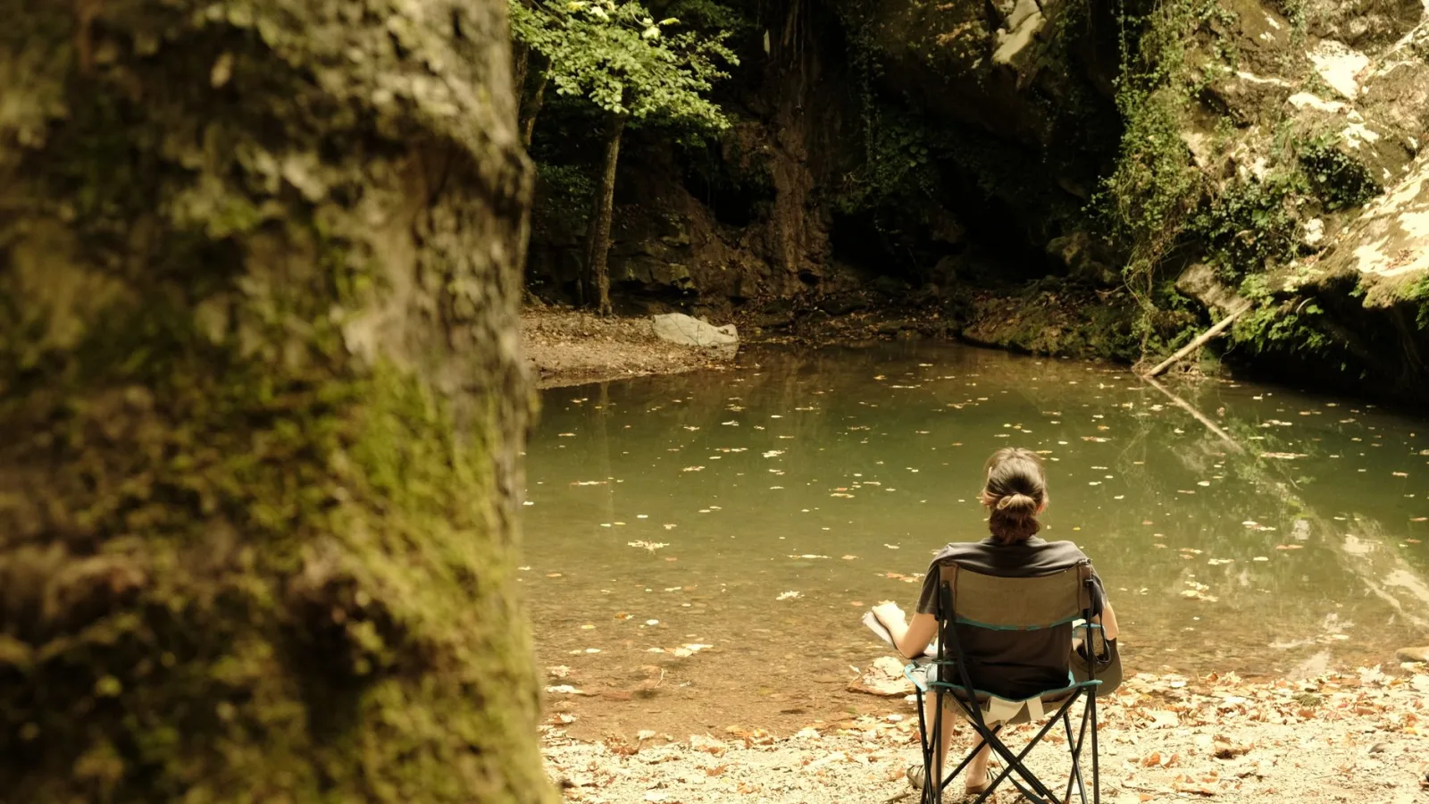 A person enjoying solitude by a serene lake in Hacıllı, İstanbul, Türkiye.