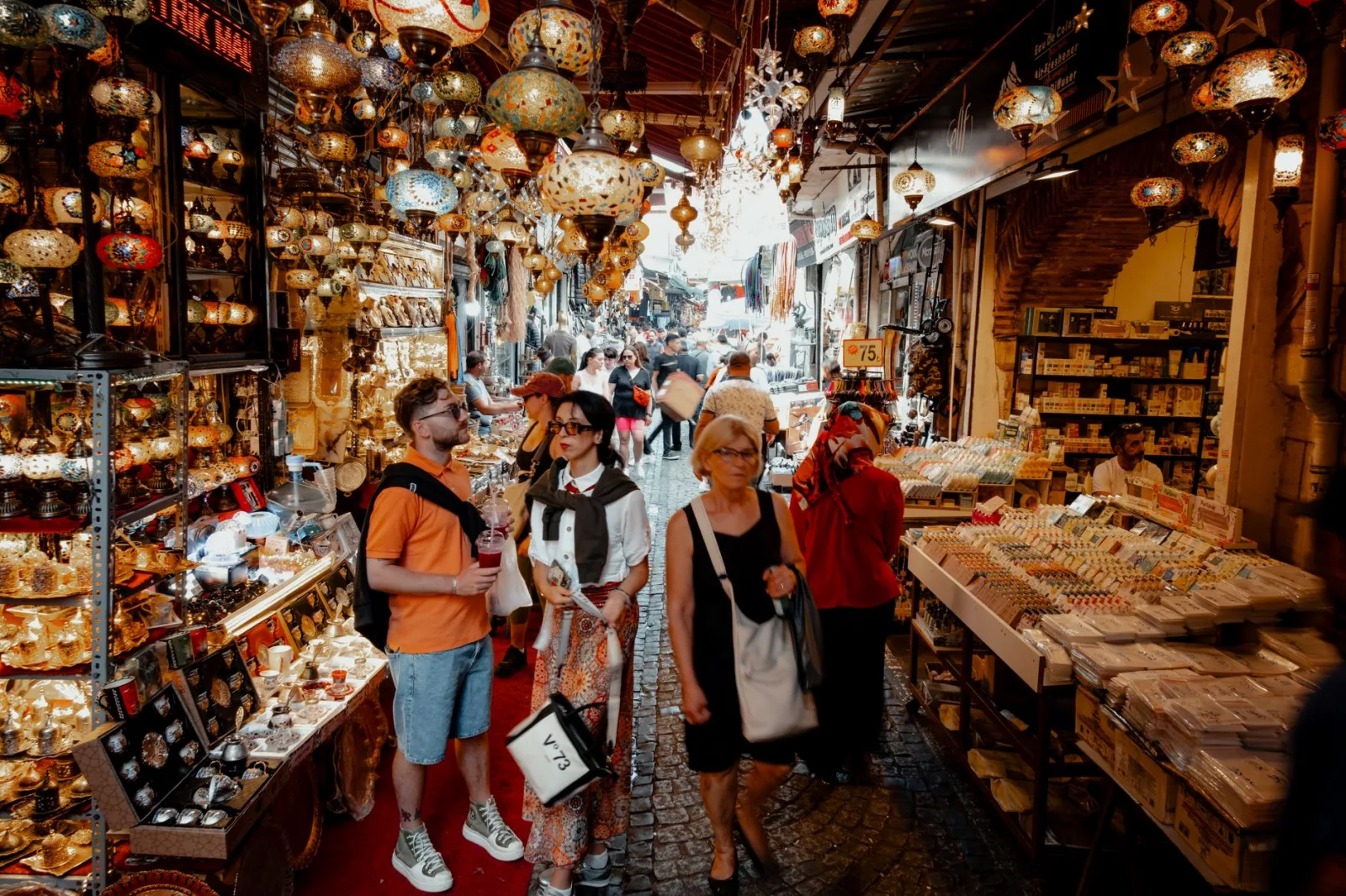 Bustling shoppers explore the colorful Grand Bazaar in Istanbul, a lively historic market full of authentic Turkish items.