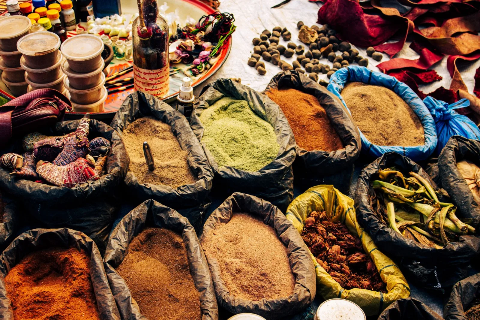 Vivid spices and herbs at an outdoor market in Ngel Nyaki, Nigeria.