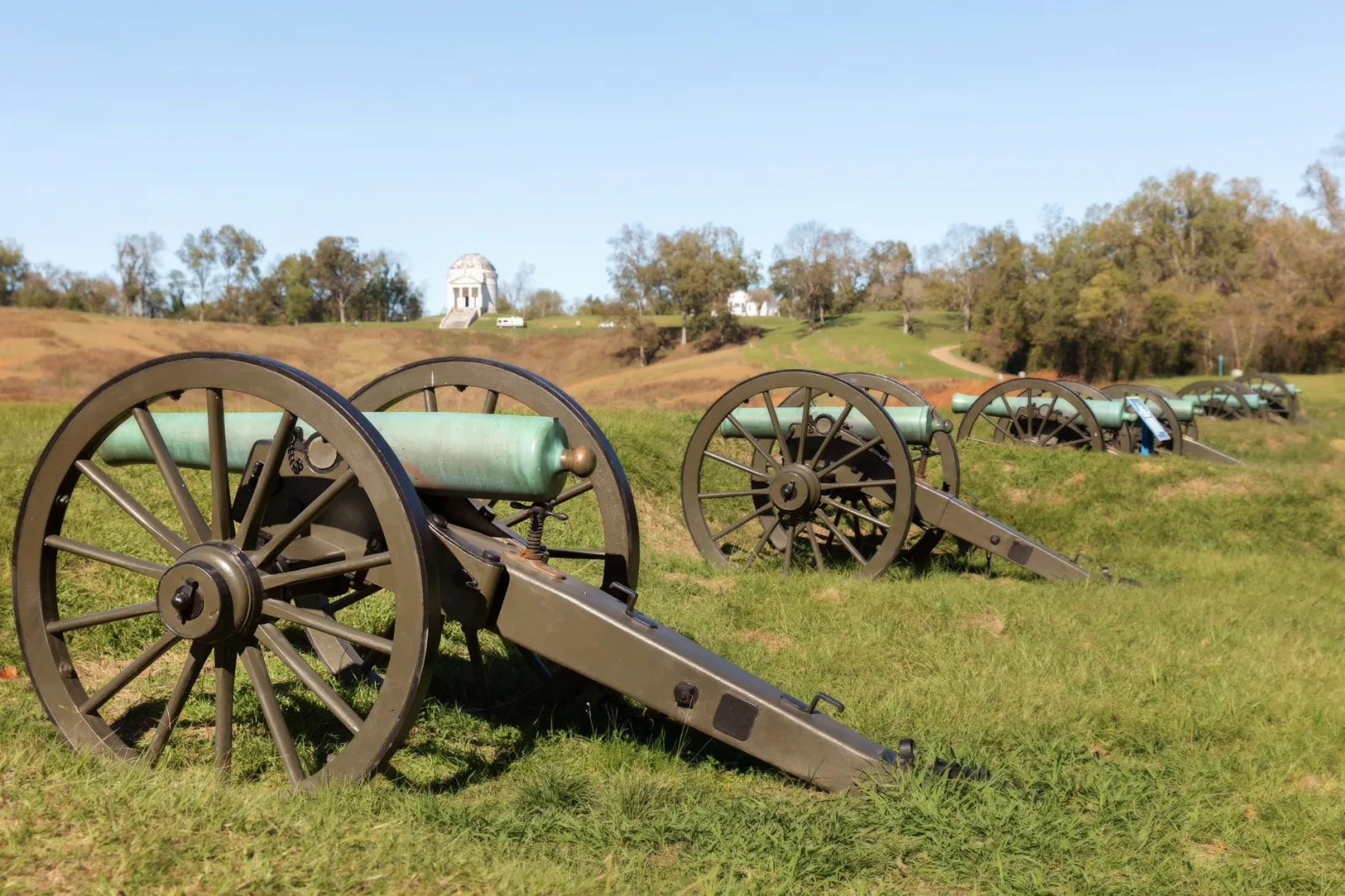 Row of historic cannons displayed outdoors at Vicksburg National Military Park, Mississippi.