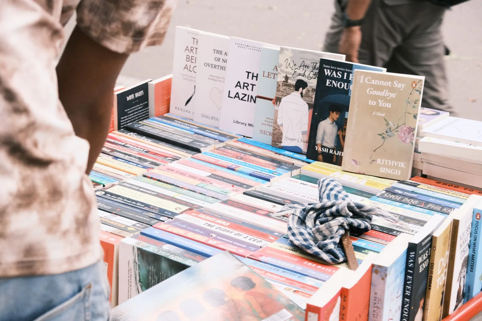Vibrant outdoor book market scene in Bengaluru featuring diverse book collection.