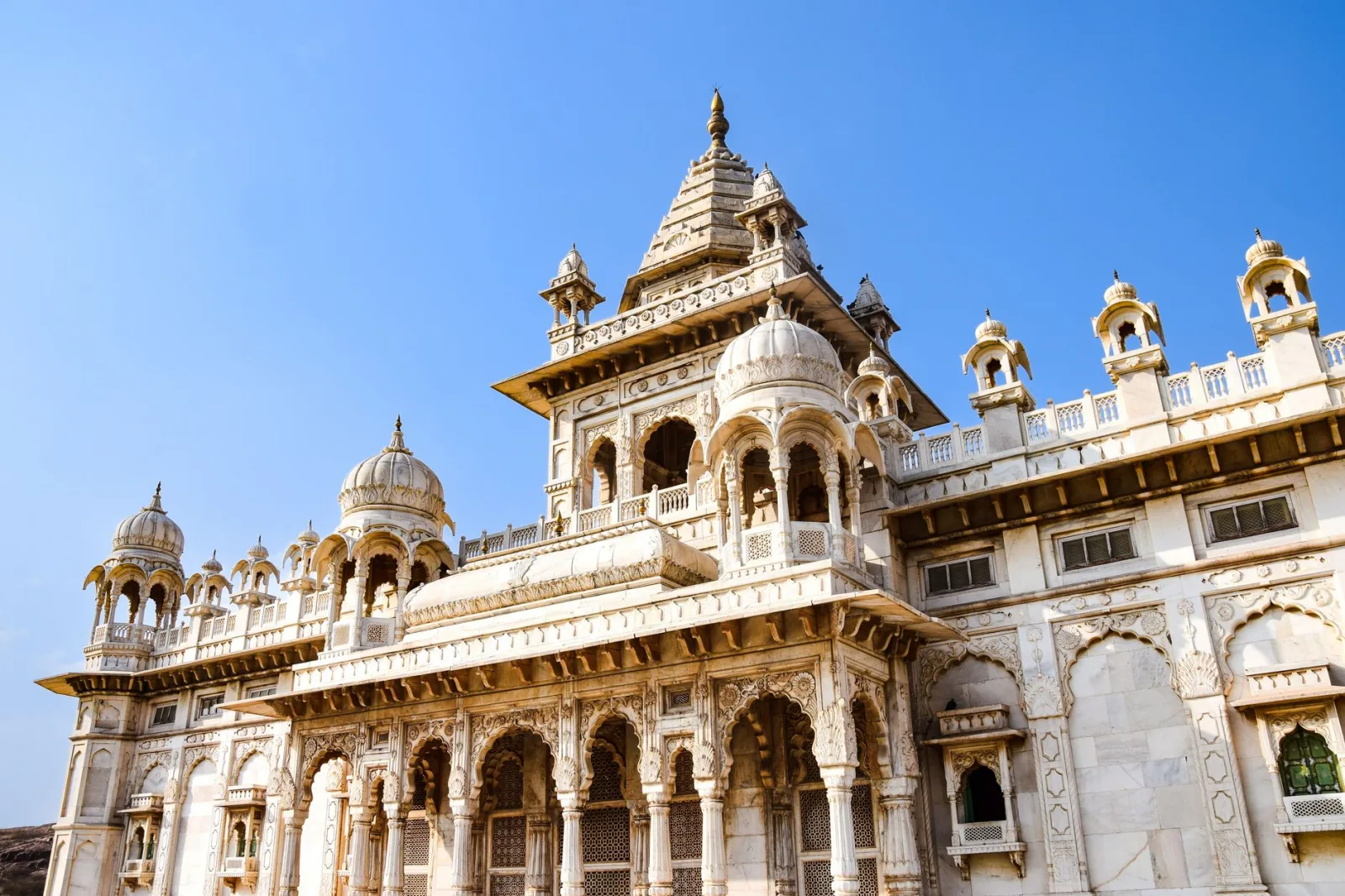 Majestic view of Jaswant Thada mausoleum in Jodhpur, India under the bright blue sky.