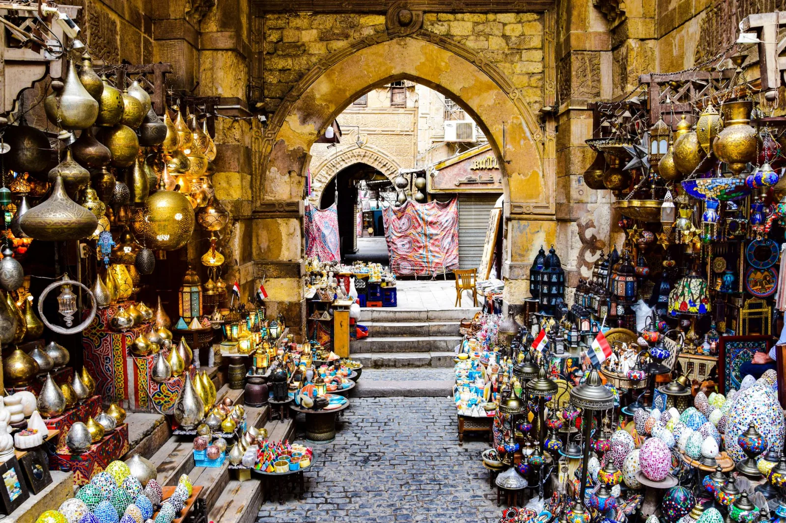 Vibrant display of traditional crafts and vibrant lanterns in an Egyptian bazaar.