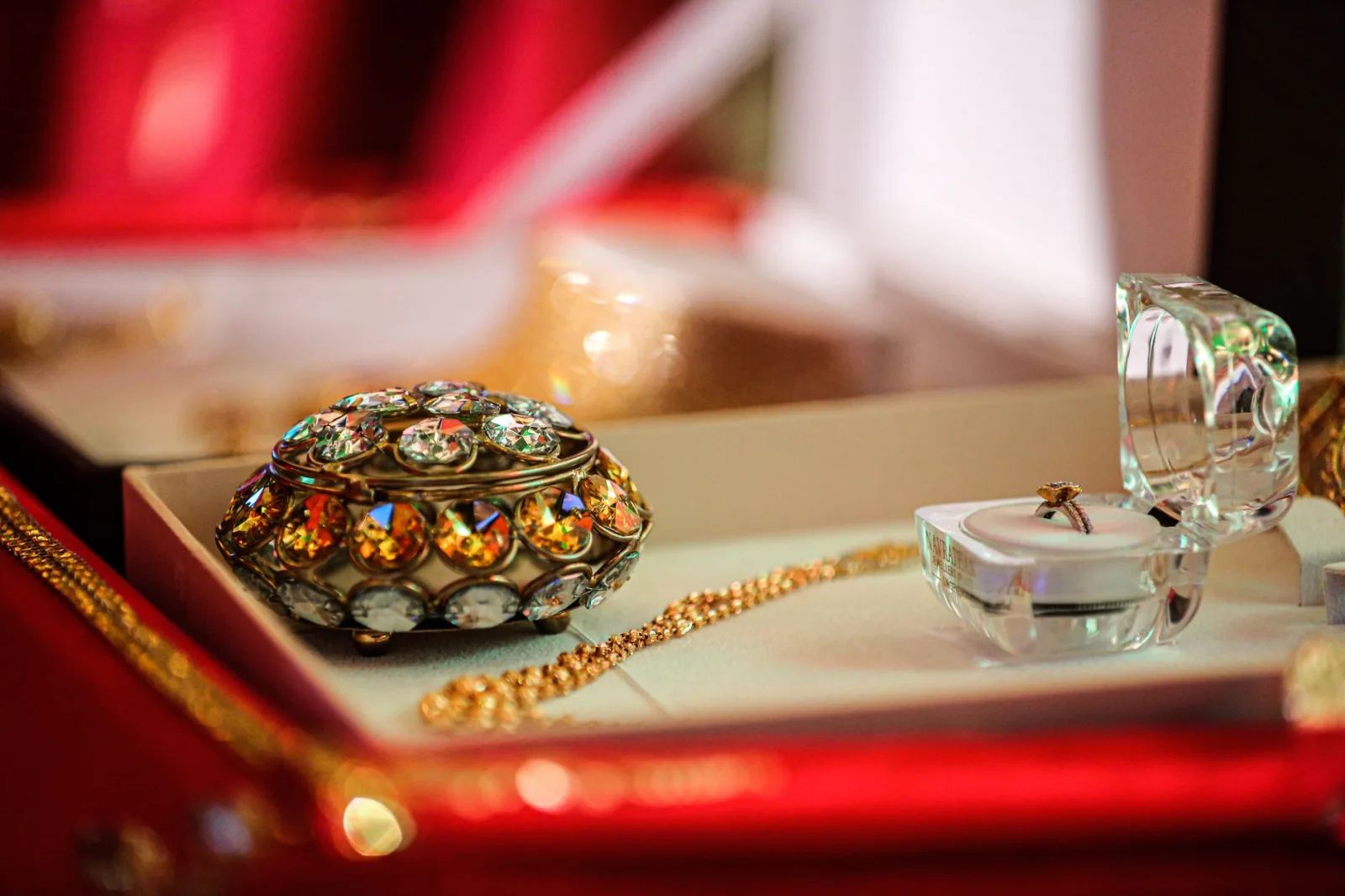 Close-up of a luxurious jewelry box with exquisite gold and jeweled accessories in an elegant display.