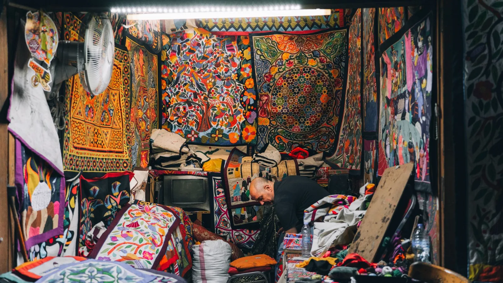 Vibrant textile shop in Cairo, showcasing colorful patterns and traditional crafts.