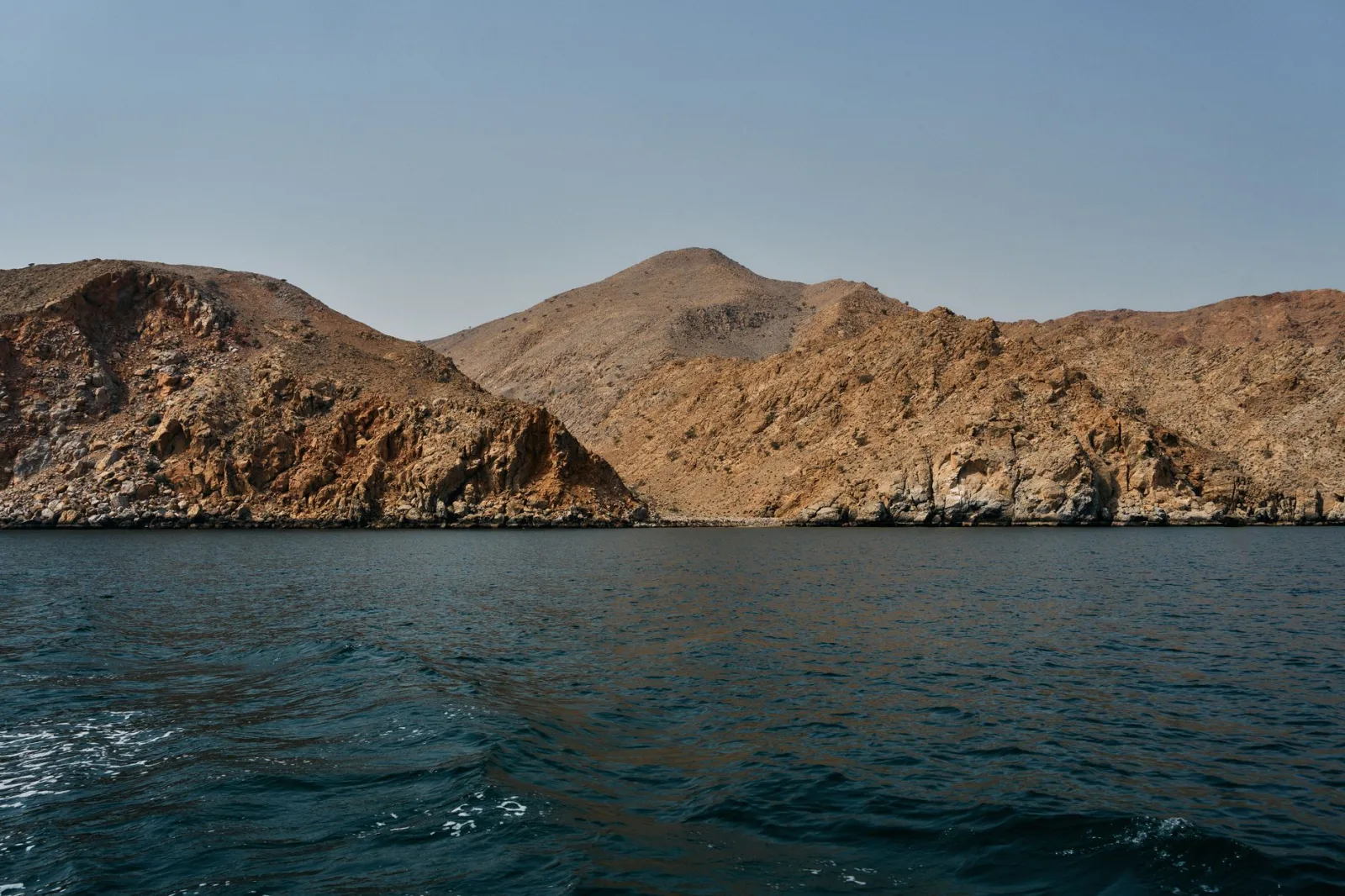 Stunning view of the rugged rocky coastline along the Musandam Peninsula in Oman.